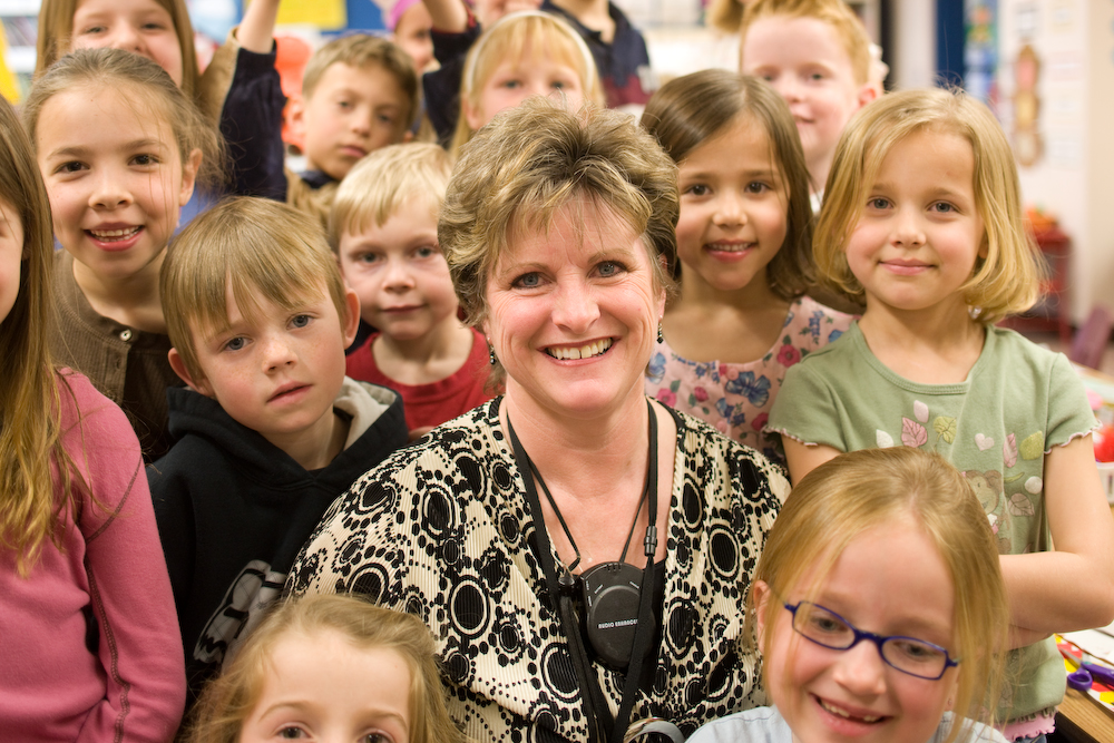 Teacher with smiling students 